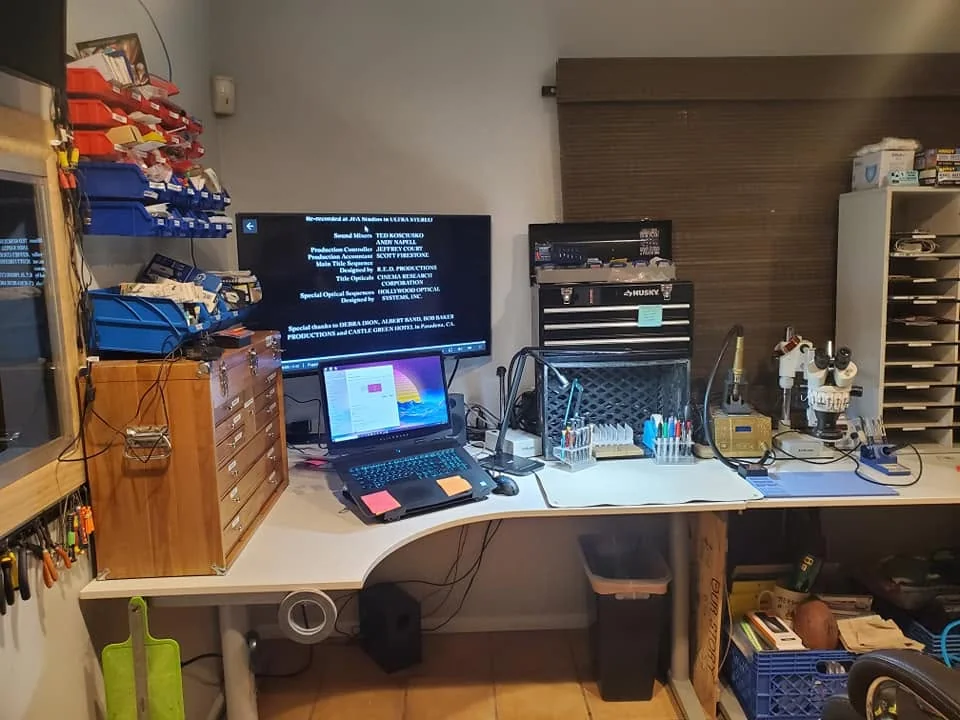 Cell phone repair workbench with tools and equipment