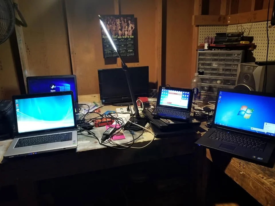 Laptop running diagnostic tests on the repair bench